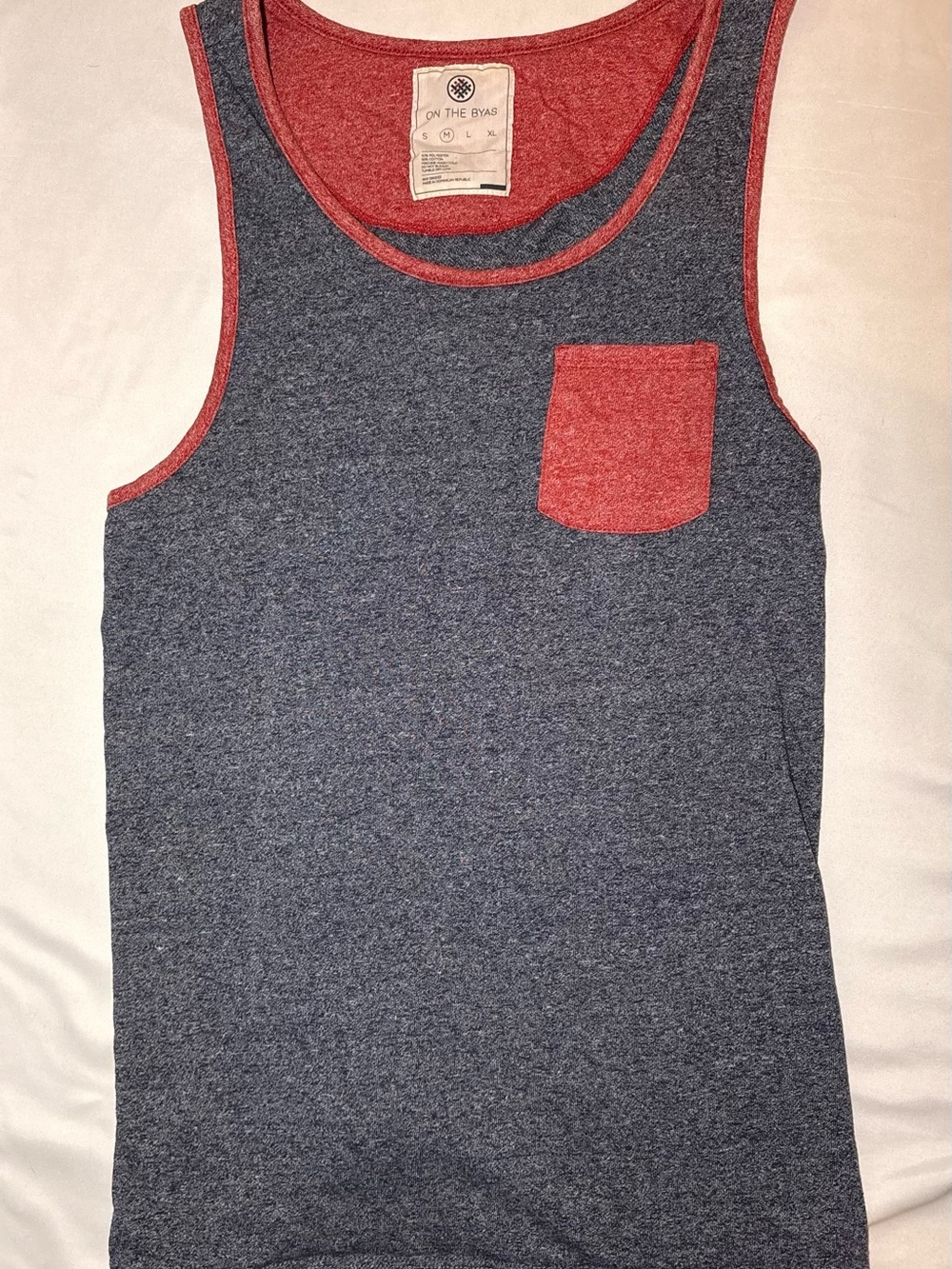 on the byas Navy Tank Top with Red Pocket & Trim